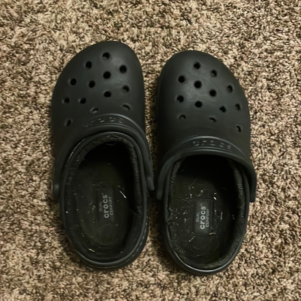I am selling black crocs they have a little bit of grass in them.